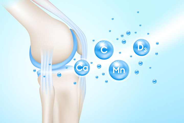 Natural Pharmaceuticals CalciumControl™ Põlveliigese illustratsioon, millel on märgitud kõhre ja kõõlused, ümbritsetud siniste mullidega, mis sümboliseerivad toitaineid: Ca (kaltsium), C (vitamiin C), Mn (mangaan), D₃ (vitamiin D3). Graafika viitab liigeste ja luude tervise toetamisele.